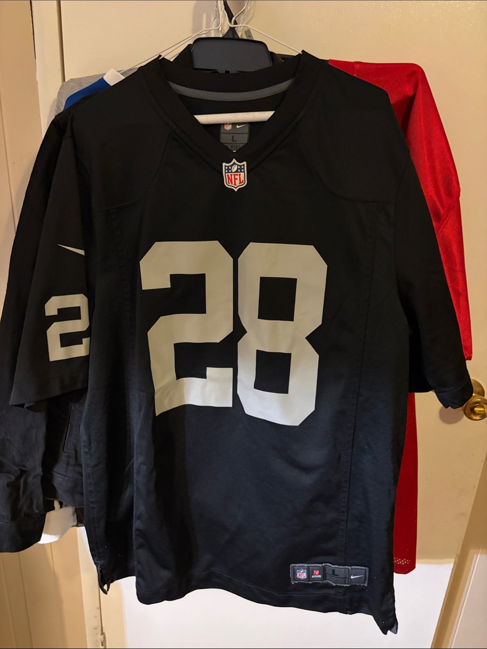 NFL Raiders men’s ' Black #28 Football size L Jersey